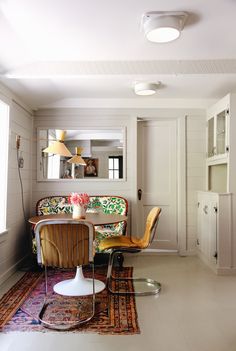 the living room is clean and ready for guests to use it as a dining area