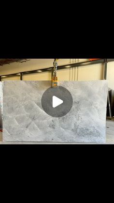 a large marble slab being worked on in a shop