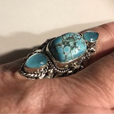 This Stunning 925 Sterling Silver Turquoise Ring Is Beautiful. 925 Sterling Silver. Size 7 20 Carats Of Turquoise Stones. 4 Carats Of Chalcedony Stones. Turquoise And Wealth. Turquoise Has Long Been A Symbol Of Luxury And Wealth. Wherever This Gemstone Is Found, It Is Always Symbolic Of Abundance. All Of My Listings Are Authentic Jewelry. “Stamped” 925 On The Back Of Jewelry. Tags. 100% Authentic Real Stones. 925 Sterling Silver, Necklace, Ring, Bracelet, Cuff Bracelet, Earring. Midcentury, Vint Silver Turquoise Ring For Anniversary, Fine Jewelry Silver Turquoise Ring For Anniversary, Silver Turquoise Ring With Accent Stones In Sterling Silver, Silver Turquoise Gemstone Ring In Sterling Silver, Silver Turquoise Ring In Sterling Silver, Sterling Silver Turquoise Ring With Accent Stones As Gift, Silver Turquoise Gemstone Ring For Anniversary, Turquoise Three Stone Ring For Gift, Anniversary Sterling Silver Multi-stone Turquoise Ring