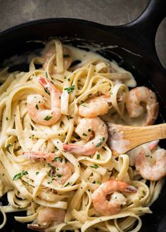 pasta with shrimp and parmesan in a skillet, ready to be eaten