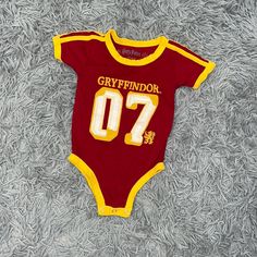 - Harry Potter - Baby - Gryffindor Onsie - Short Sleeves - Red And Yellow - Size: 12 Months - New Without Tags - Purchased From The Nyc Store Red Short Sleeve Cotton Bodysuit, Red Cotton Short Sleeve Bodysuit, Red Fitted Bodysuit For Playtime, Red Fitted Bodysuit For Casual Wear, Cute Red Short Sleeve Bodysuit, Red Short Sleeve Onesie For Playtime, Red Fitted Cotton Bodysuit, Cute Red Fitted Bodysuit, Cute Fitted Red Bodysuit