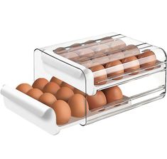 two trays filled with eggs in front of each other