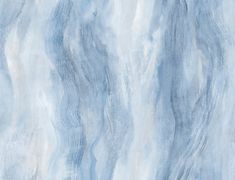 a blue marble textured wallpaper with white and gray streaks on the top right side