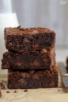 three chocolate brownies stacked on top of each other