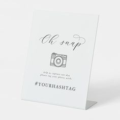 a white card with the words oh snap and a camera on it's front