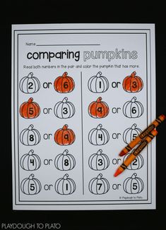 a pumpkin themed worksheet for comparing numbers