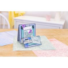 two cards sitting on top of a table next to each other with the words i love you