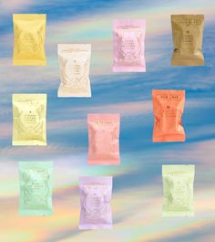 six packets of various flavored snacks in front of a blue sky with white clouds