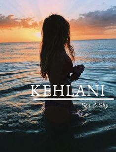 a woman standing in the ocean at sunset with her back turned to the camera and text, kehlani sea & sky