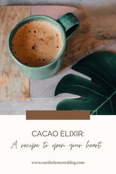 a cup of cacao eliir on top of a wooden table