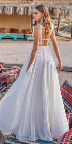 a woman in a white dress on the beach