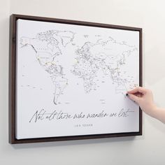 a person writing on a map with the words not all who wander are lost