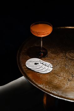 a drink sitting on top of a wooden table