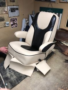 a white and black chair sitting on top of a table