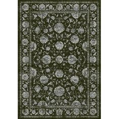 a dark green rug with white and gray flowers on the bottom, in an ornate pattern