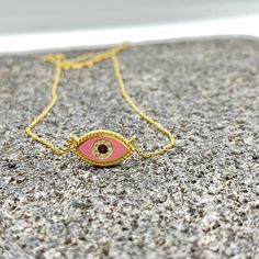 MELIGreece's lovely feminine chain necklace made of 18k yellow gold, a pink enamel eye with dotted surrounding, one central natural ruby weighting 0.01 cts. framed with natural diamonds weight in total : 0.03 cts. Dimensions of the eye charm : 1.7 cm. * 7.0 mm. / 0.67 - 0.27 inch. Length of the pink ruby diamond eye chain necklace : 39. 0 - 42. 0 cm. / 15.35 - 16.53 inch. A special gift proposal for this spring, accompanied by a stylish jewelry box and gift packaging. We combine it with MELIGreece's white diamond solid gold chain necklace https://www.etsy.com/listing/884490334/white-diamond-18k-yellow-or-rose-gold?click_key=d13d6ae24831f16551c74c1876b4d6af3387a9b5%3A884490334&click_sum=ceb56877&ref=shop_home_active_6&frs=1&sts=1. Important note: the enamel we use in our jewelry is of excel Pink Pendant Charm Necklace With Delicate Chain, Pink Pendant Necklace With Adjustable Chain, Pink Gold Plated Round Necklace, Handmade Pink Gold-plated Jewelry, Handmade Yellow Gold Enamel Necklace, Dainty Pink Jewelry With Adjustable Chain, Pink Delicate Chain Jewelry As Gift For Her, Pink Necklace With Adjustable Chain For Her, Pink Delicate Chain Necklaces As Gift For Her