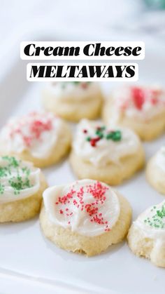 small cookies with white frosting and green sprinkles on a square plate