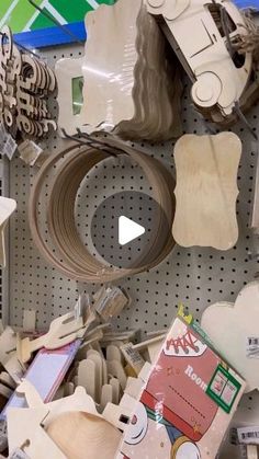 there are many different items on the shelf in this store, including scissors and other crafting supplies