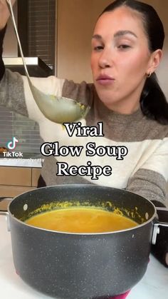 a woman holding a ladle in front of a bowl of soup with the words virtual glow soup recipe