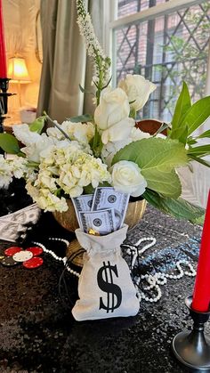 a vase filled with flowers sitting on top of a table