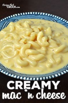 creamy mac n cheese in a blue and white bowl with the words creamy mac n cheese