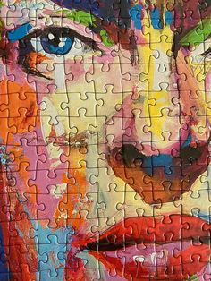 a close up of a puzzle with a woman's face