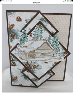 a card with a house and pine trees on it