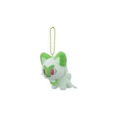 a green and white keychain shaped like a cat