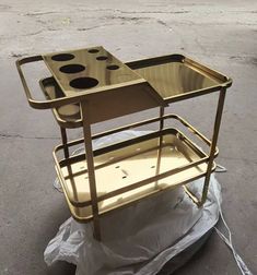 a metal cart sitting on top of a tarp