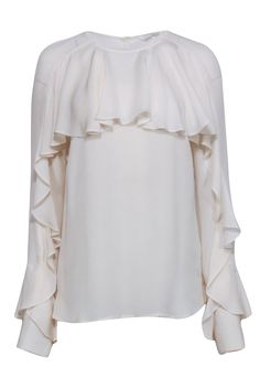 A ruffled blouse to rival all others by Veronica Beard. Crafted from luxurious silk, one large ruffle extends across the chest and the length of both sleeves for a modern take on frill. A hi-low hem allows it to be worn tucked into trousers or left out over skinny jeans. The double keyhole back adds an extra style surprise! Size 10 100% Silk Long sleeve Hi-low hem Double keyhole back Back button closure Bust 38" Waist 40" Shoulder to hem front 24.5" Shoulder to hem back 27" Sleeve length 26.5" Elegant White Top With Ruffle Hem, Elegant White Tops With Ruffle Hem, Elegant Ruffled Blouse For Work, Chic Formal Blouse With Ruffle Sleeves, Chic Formal Tops With Ruffle Sleeves, Elegant Blouse With Ruffled Collar And Ruffle Hem, Elegant Blouse With Ruffles And Ruffled Collar, Elegant Evening Top With Ruffle Hem, Elegant Evening Tops With Ruffle Hem