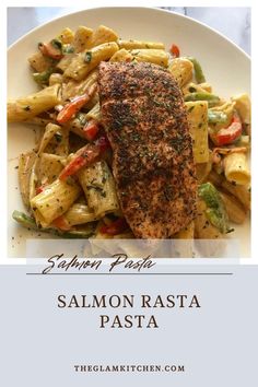 salmon with pasta and vegetables on a white plate in front of the words salmon pasta