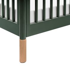 a green bed frame with wooden slats