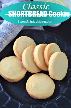 shortbread cookies on a black plate with the words classic shortbread cookie over it