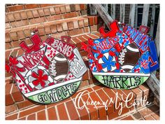 two hand painted plates sitting on top of brick steps