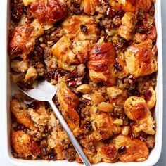 a casserole dish filled with stuffing and meat