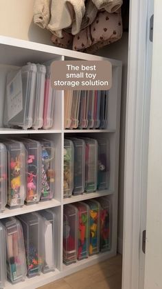 an organized closet with clear storage bins filled with toys