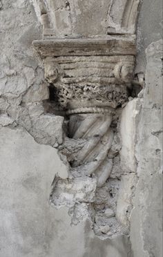 an old building that has been gutted with cement