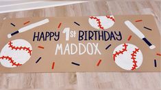 a cardboard birthday card with baseballs and bats