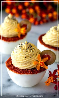 three small cupcakes with frosting and sprinkles on them are shown