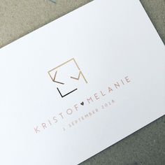 a close up of a business card on the ground with a logo for kristo of melanie