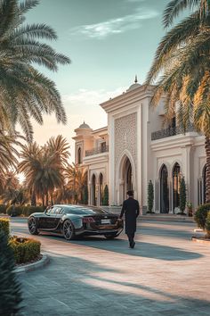 a man walking towards a luxury car parked in front of a building