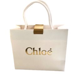 Beautiful White Chloe Shopping Bag With Gold Logo And Ribbon. (Medium Size) Size: 10” X 8.5” X 4” Ribbon 31” New Never Used. White Bags With Gold-tone Hardware For Gifts, White Bags With Gold-tone Hardware As A Gift, White Shoulder Bag With Gold-tone Hardware As Gift, Chloe Bags, Bags Luxury, Chloe Bag, Gold Logo, Womens Tote Bags, Medium Size