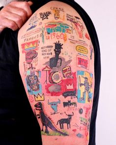 a man's arm covered in lots of different things on it, including pictures and words