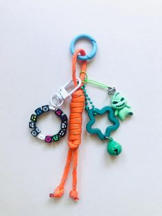 an orange lanyard with some charms attached to it