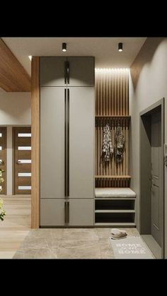 a modern kitchen with wood paneling and stainless steel refrigerator freezer, built into the wall