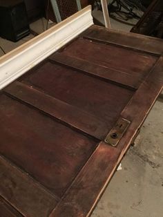 an old wooden bed frame is being worked on