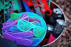 a bucket filled with lots of different colored items