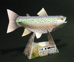 a paper model of a fish on display