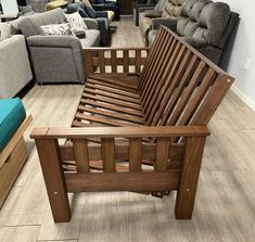 a living room filled with lots of couches and chairs next to a coffee table