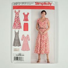 a woman in a dress and heels standing next to a wall with the sewing pattern on it